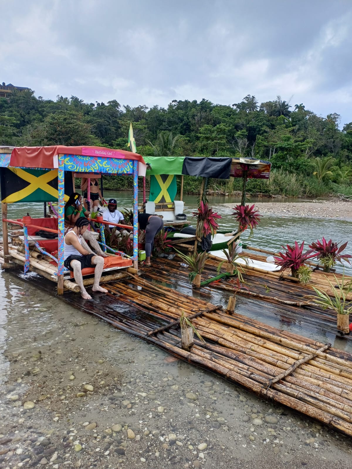 Bamboo rafts decorated in Jamaican colors