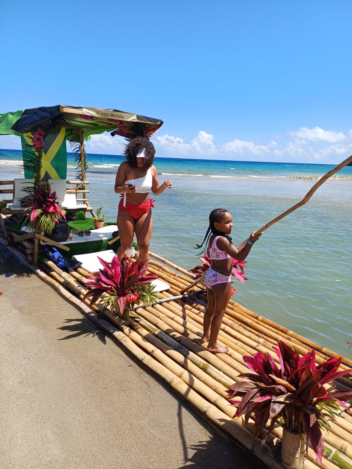 Family enjoying a bamboo raft near the Caribbean Sea