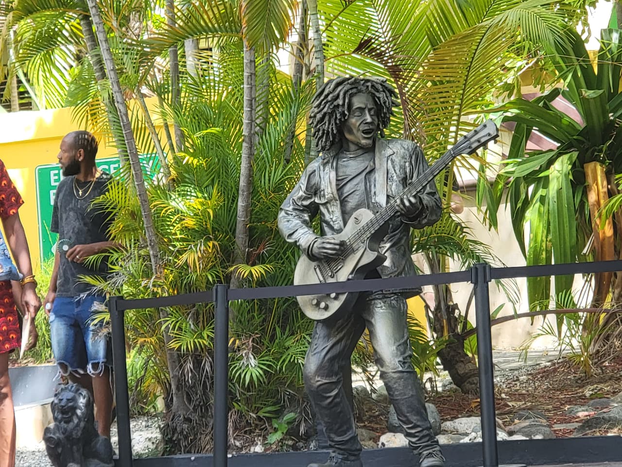 Bob Marley guitar statue in a tropical garden